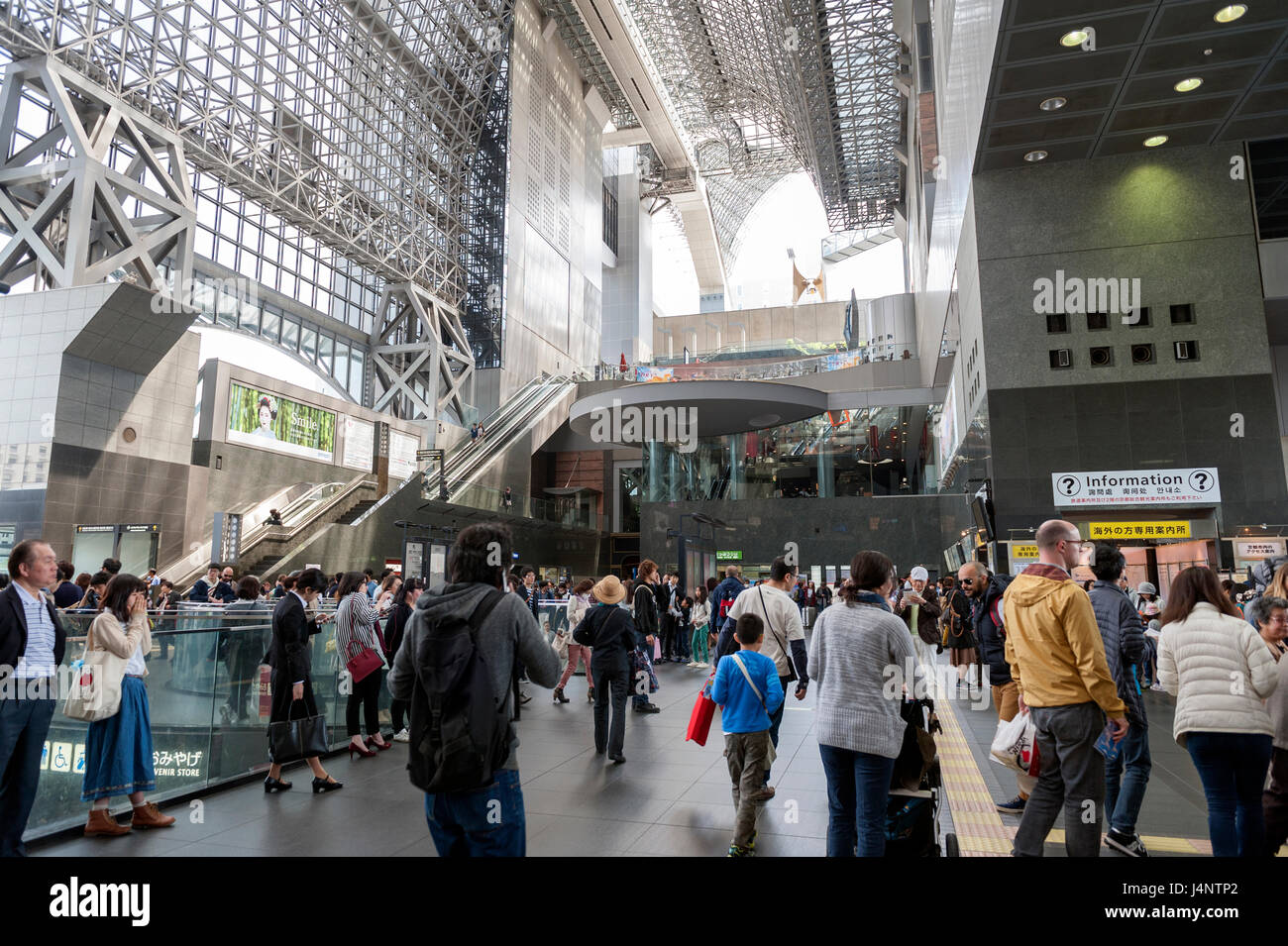 Crowd of people at passenger concourse inside Kyoto Station building