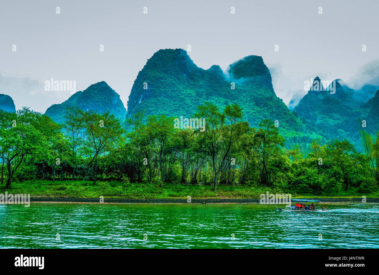 Karst mountains and Li River scenery in the mist Stock Photo