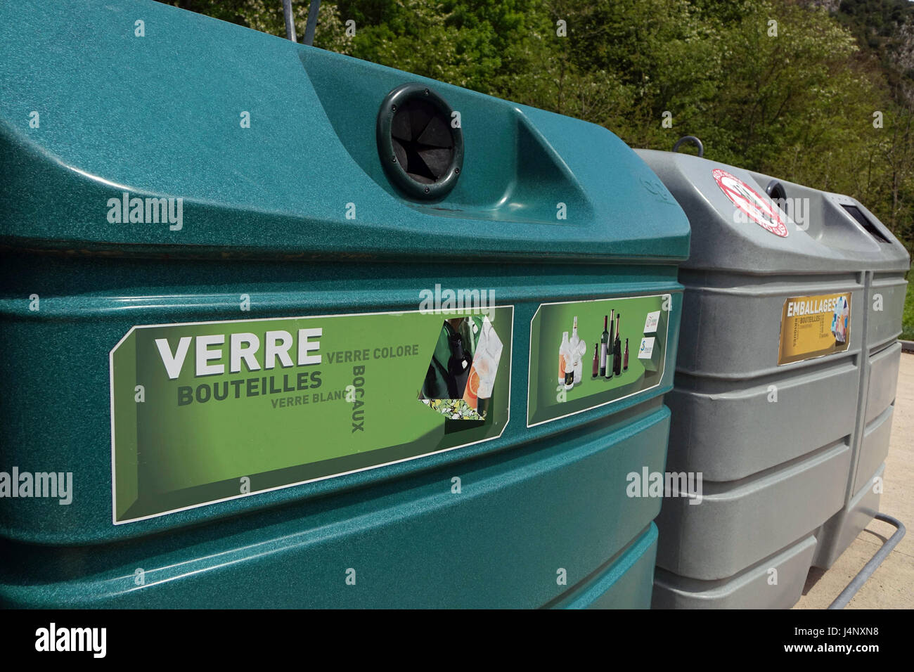 Large coloured recycling bins for glass paper and packaging Stock Photo