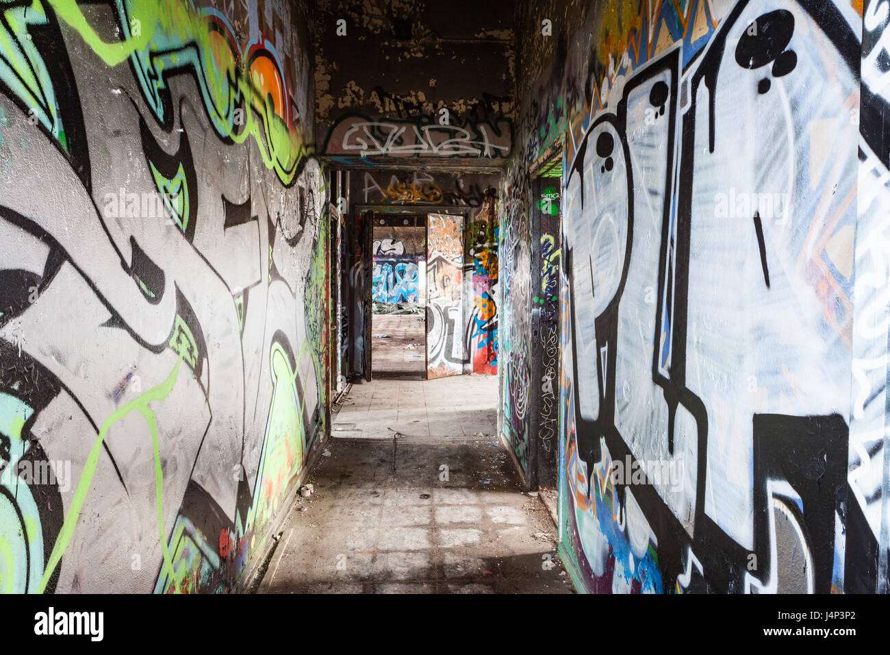 Graffiti corridor in abandoned factory Stock Photo