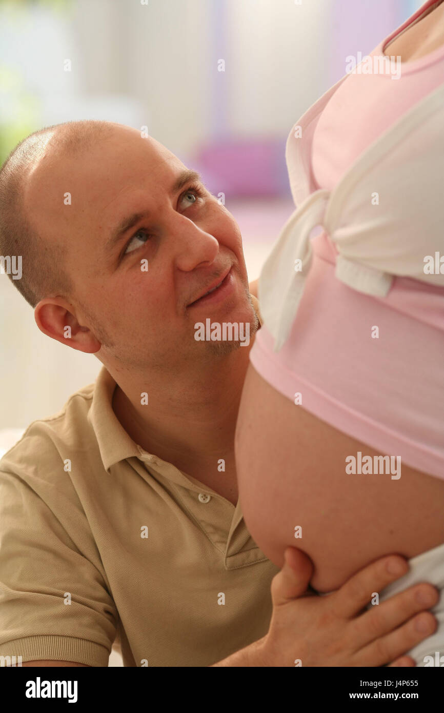 Couple, young, falls in love, woman, pregnant, detail, abdomen, man, touch, model released, people, family, pregnant, father, mother, feel, childbirth preparation, Indoor, gestation, bauchfrei, baby abdomen, touch, happily, Stock Photo