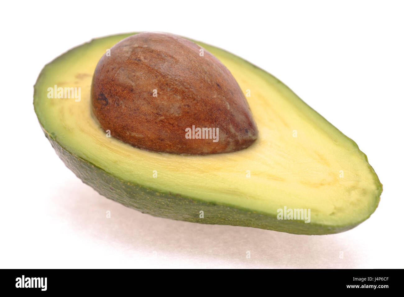 Avocado half, core, Persea americana, Stock Photo