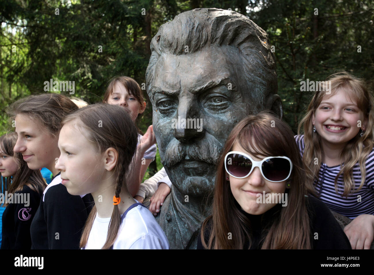 Lithuania, Grutas, Grutas park, subject park, Stalin's sculpture, school class, girl, Stock Photo