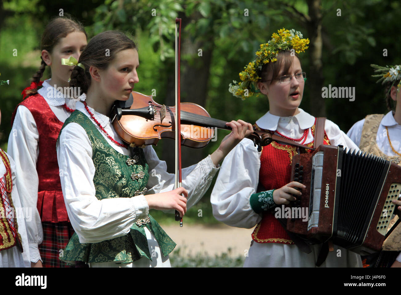 Lithuania, Vilnius, Old Town, folklore feast, girl, music group, play, half portrait, Stock Photo