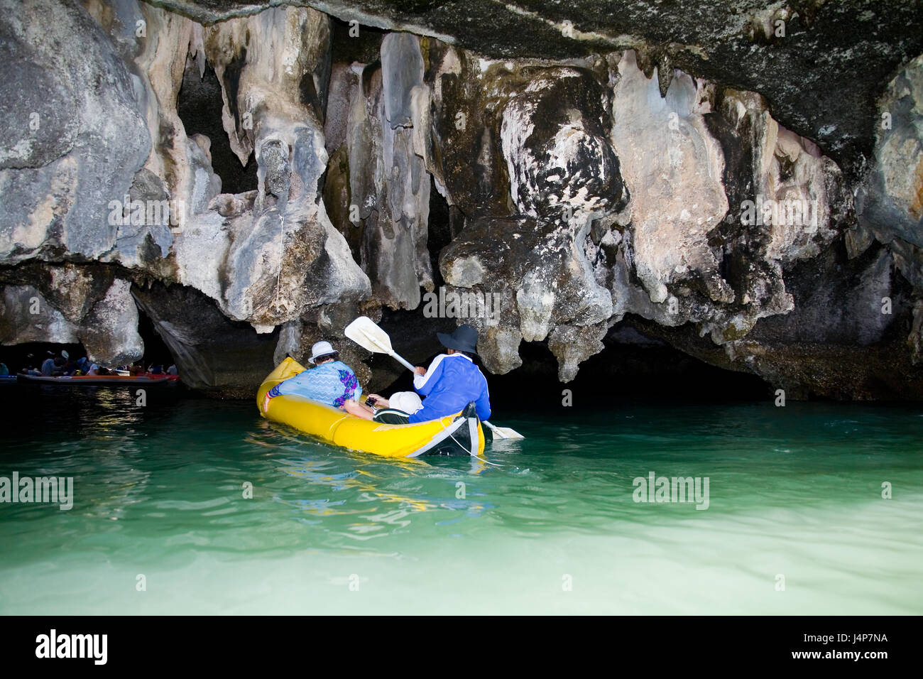 Phuket, Thailand, January 30, 2017: Tourists in boat swim into the cave of the island. Stock Photo