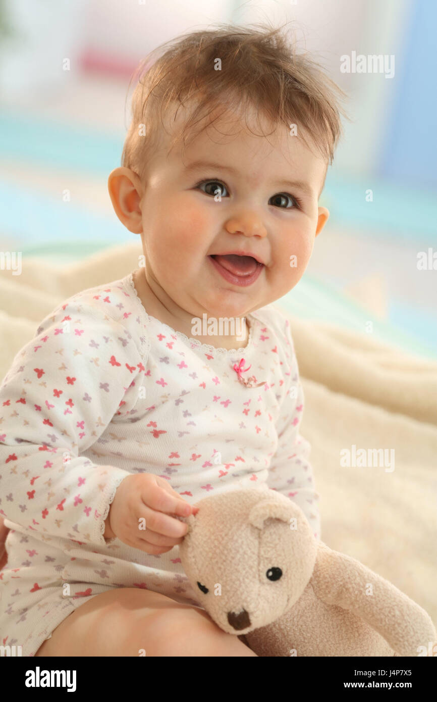 Baby, 10 months, soft animal, sit, smile, model released, people, child, infant, dresses, dark-haired, Indoor, laugh, play girl, toys, nonsense animal, Teddy, Stock Photo
