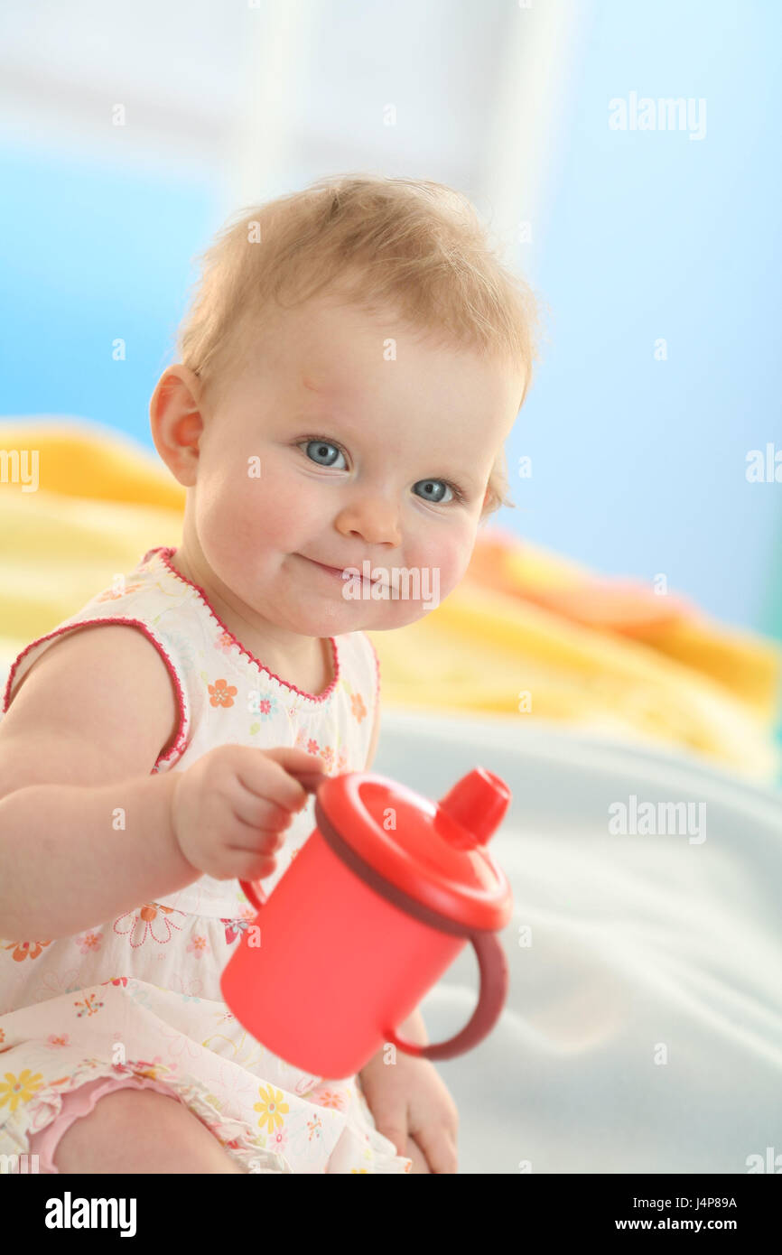 Baby, 6 months, sit, drink, invalid's cup, model released, people, child, infant, dresses, blond, reach, Indoor, learn, girls, senses, summery, drink, cup, grips, stick, smile, Stock Photo