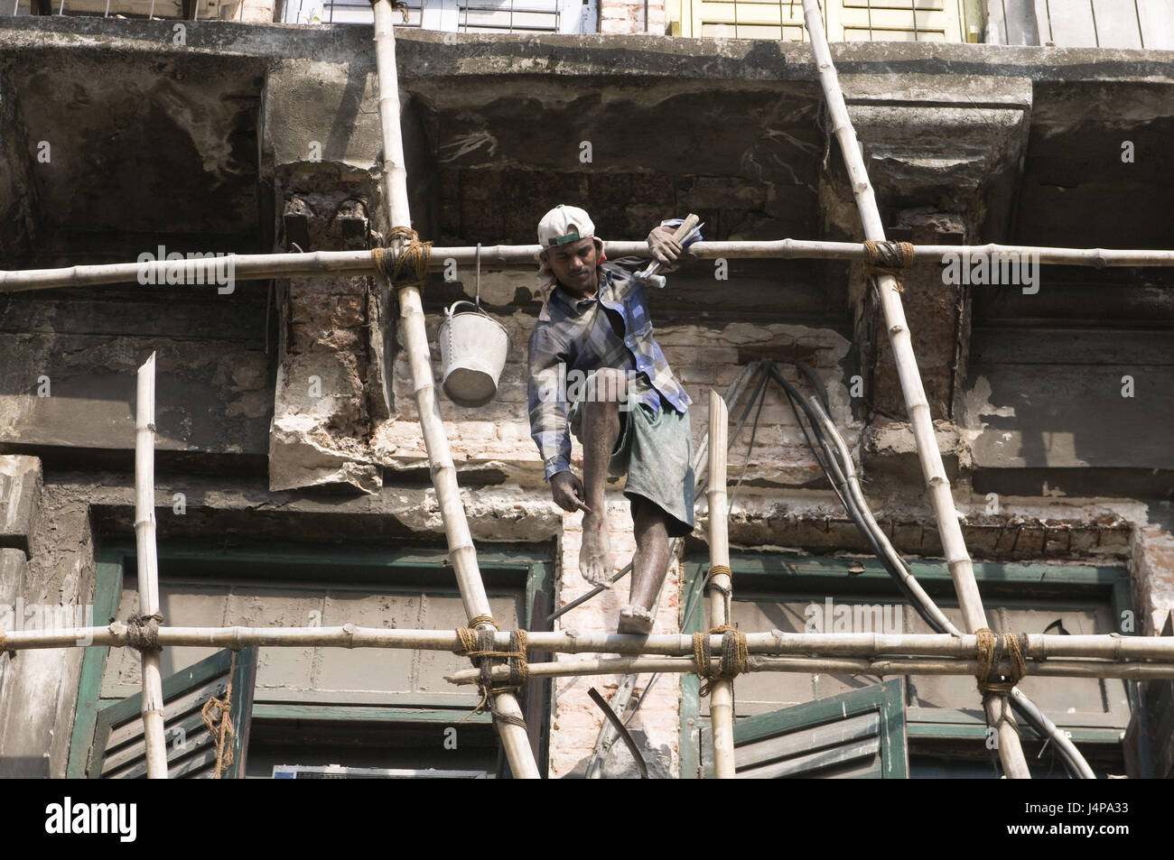 Residential house, scaffold, bamboo, dangerously, worker, balance, Calcutta, India, no model release, Stock Photo