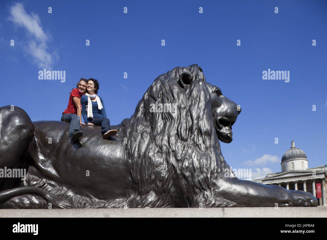 Great Britain, England, London, Trafalgar Square, lion's statue, tourists, no model release, Stock Photo