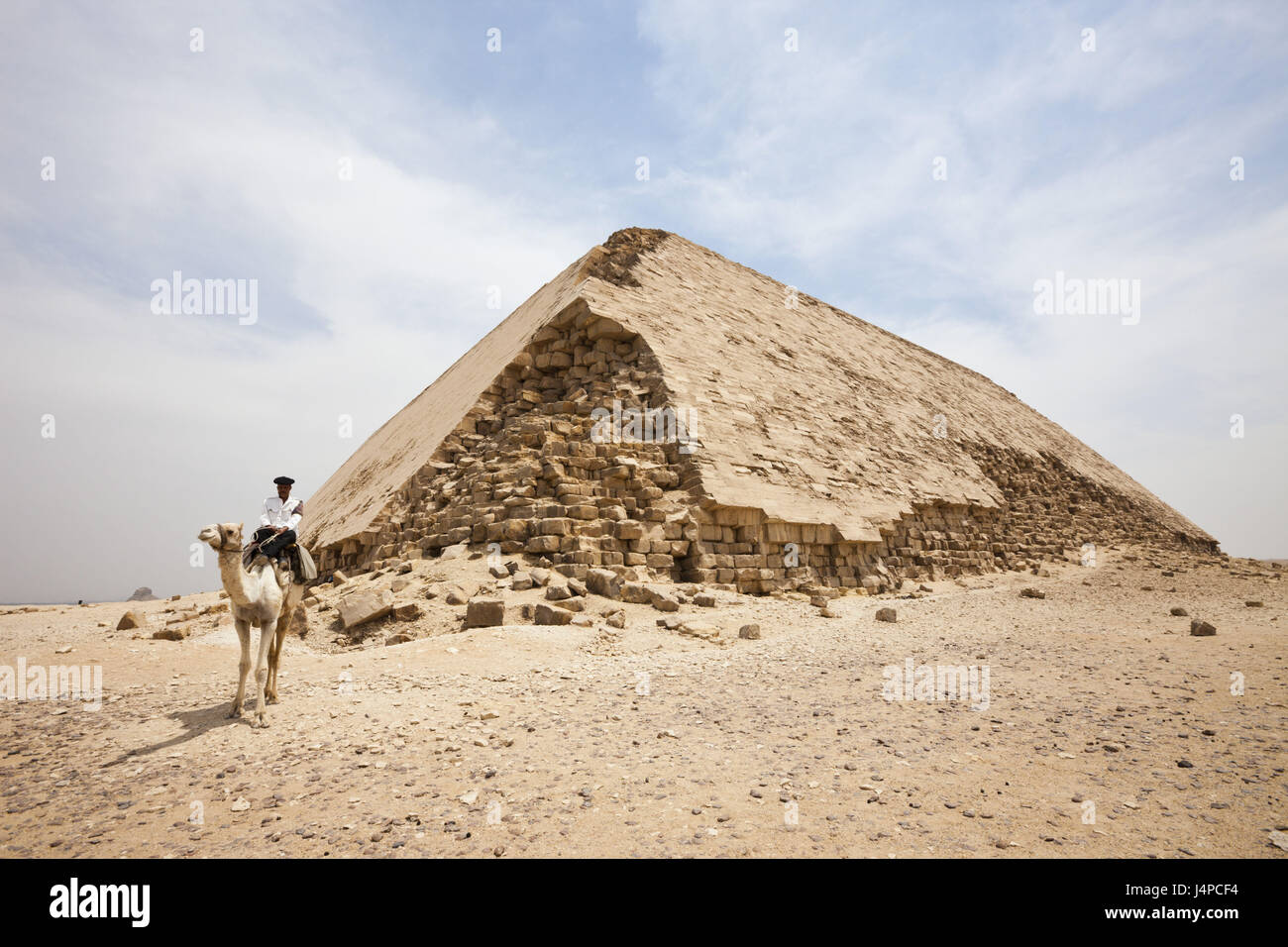 Policeman on camel beside buckling pyramid of the Pharaoh Snofru, Egypt, Dahschur, Stock Photo