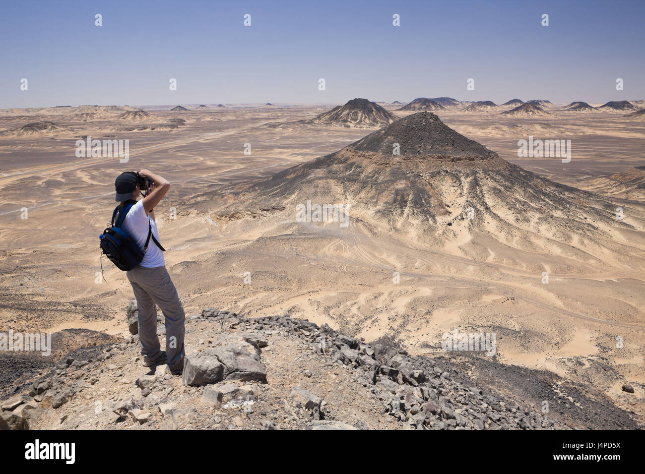Tourist in black desert, Egypt, Libyan desert, Stock Photo