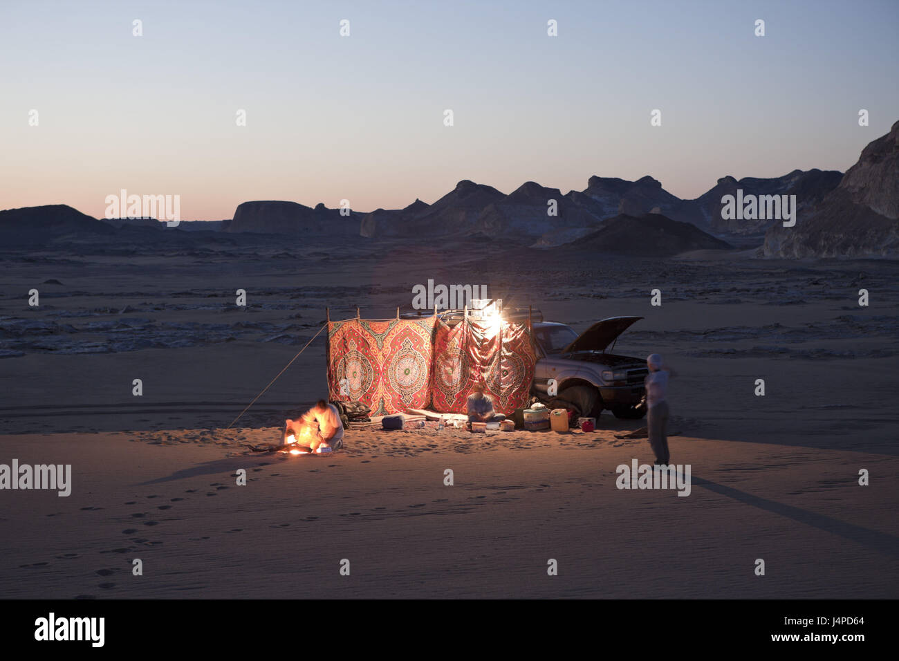 Tourists spend the night with jeep in national park white desert, Egypt, Libyan desert, Stock Photo