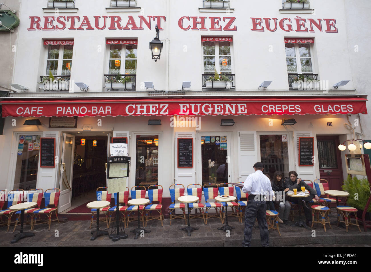 France, Paris, Montmartre, restaurant, facade, waiter, guests, no model release, Stock Photo
