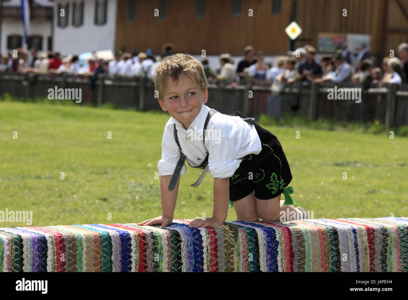 Germany, Bavaria, Upper Bavaria, priest's angle, village Ant, May running, defensive wall, boy, leather ball trousers, tickle, no model release, Stock Photo