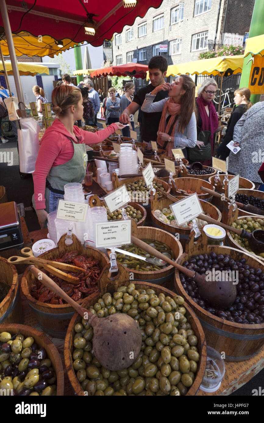 Great Britain, England, London, Southwark, borough Market, olive state, shop assistant, tourist, try, no model release, Stock Photo