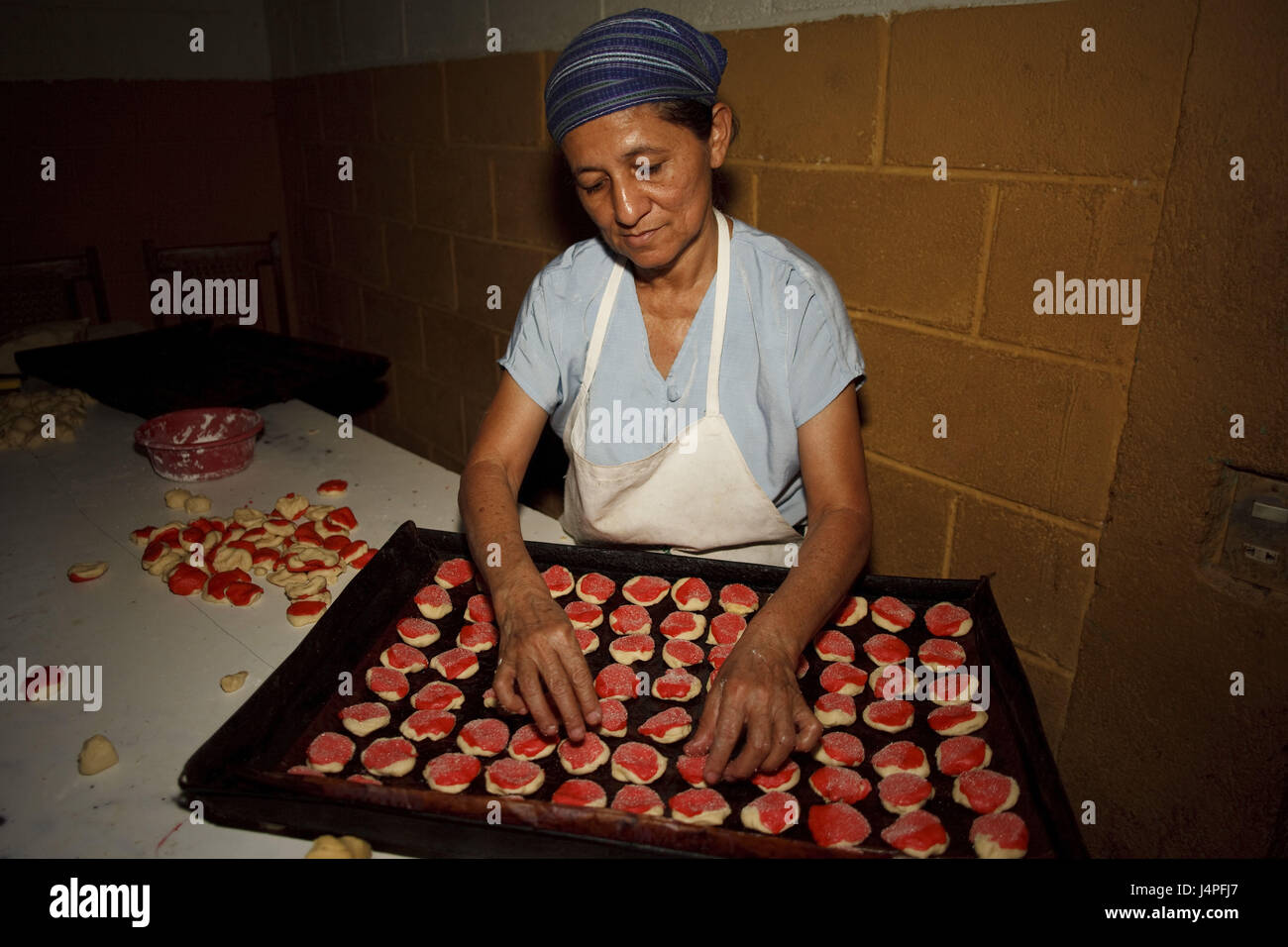 El Salvador, Ciudad Segundo Montes, baker's, woman, baking sheet, cakes and pastries Stock Photo