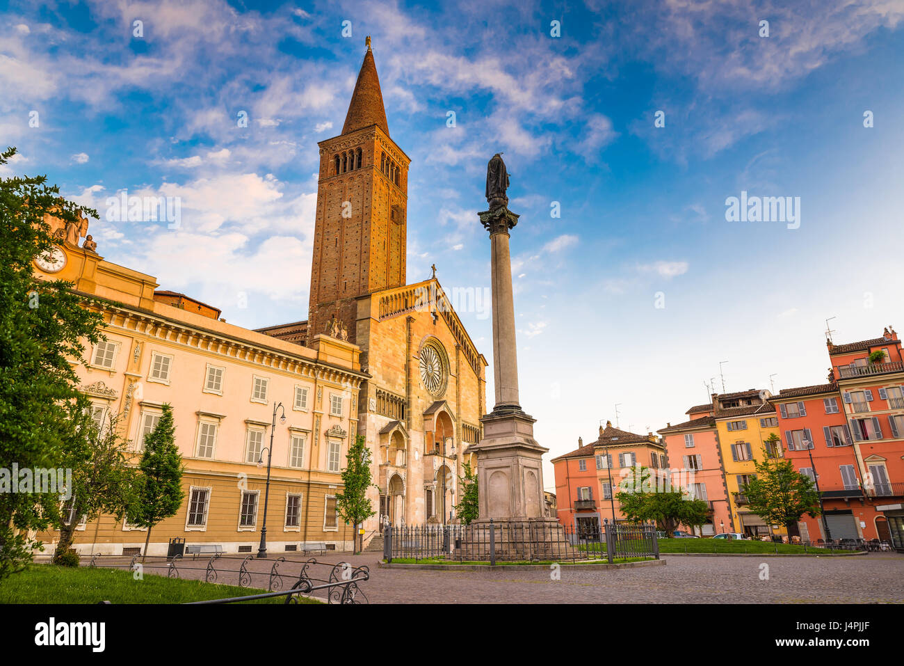 Piacenza, medieval town, Italy. Piazza Duomo in the city center with the cathedral of Santa Maria Assunta and Santa Giustina, warm light at sunset. Stock Photo