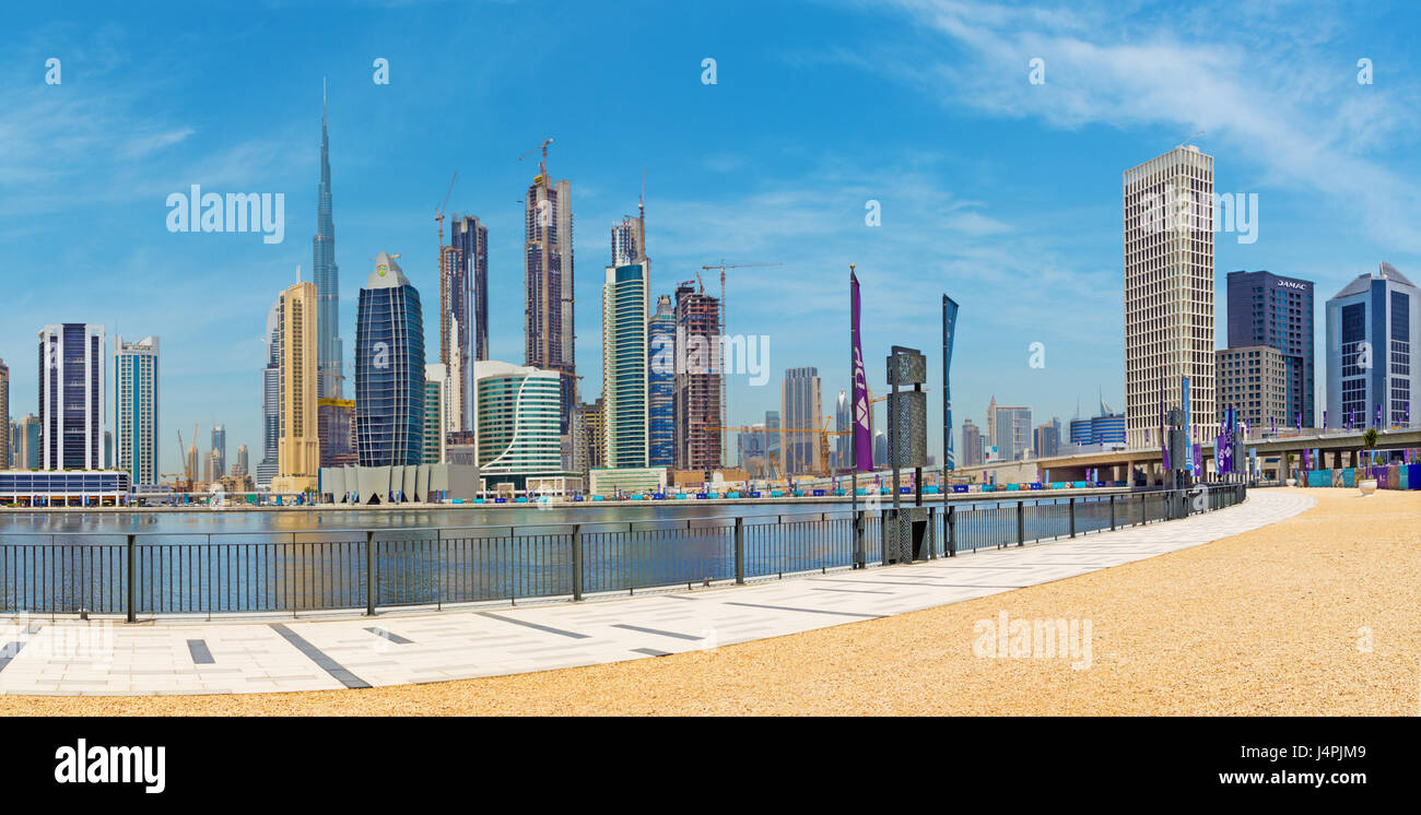 DUBAI, UAE - MARCH 29, 2017: The skyline over the new Canal and Downtown and  the promenade. Stock Photo