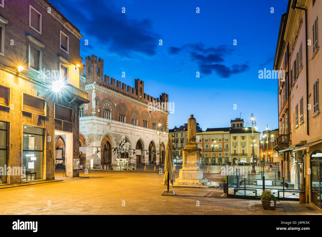 Piacenza, medieval town, Italy. Piazza Cavalli (Square horses) and palazzo Gotico in the city center on a beautiful day, at dusk. Emilia Romagna Stock Photo