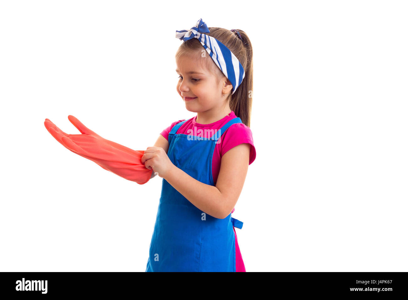 Girl in apron and gloves Stock Photo - Alamy