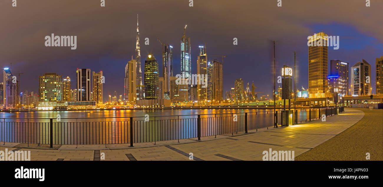 DUBAI, UAE - MARCH 24, 2017: The evening skyline over the Canal and Downtown. Stock Photo