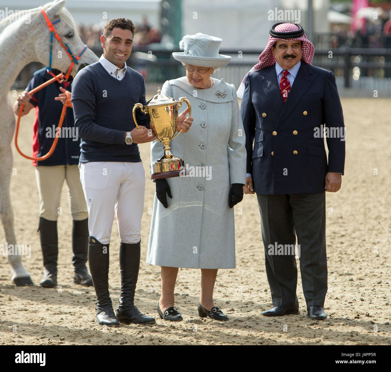 Queen Elizabeth II and the King of Bahrain present the trophy to Abdel