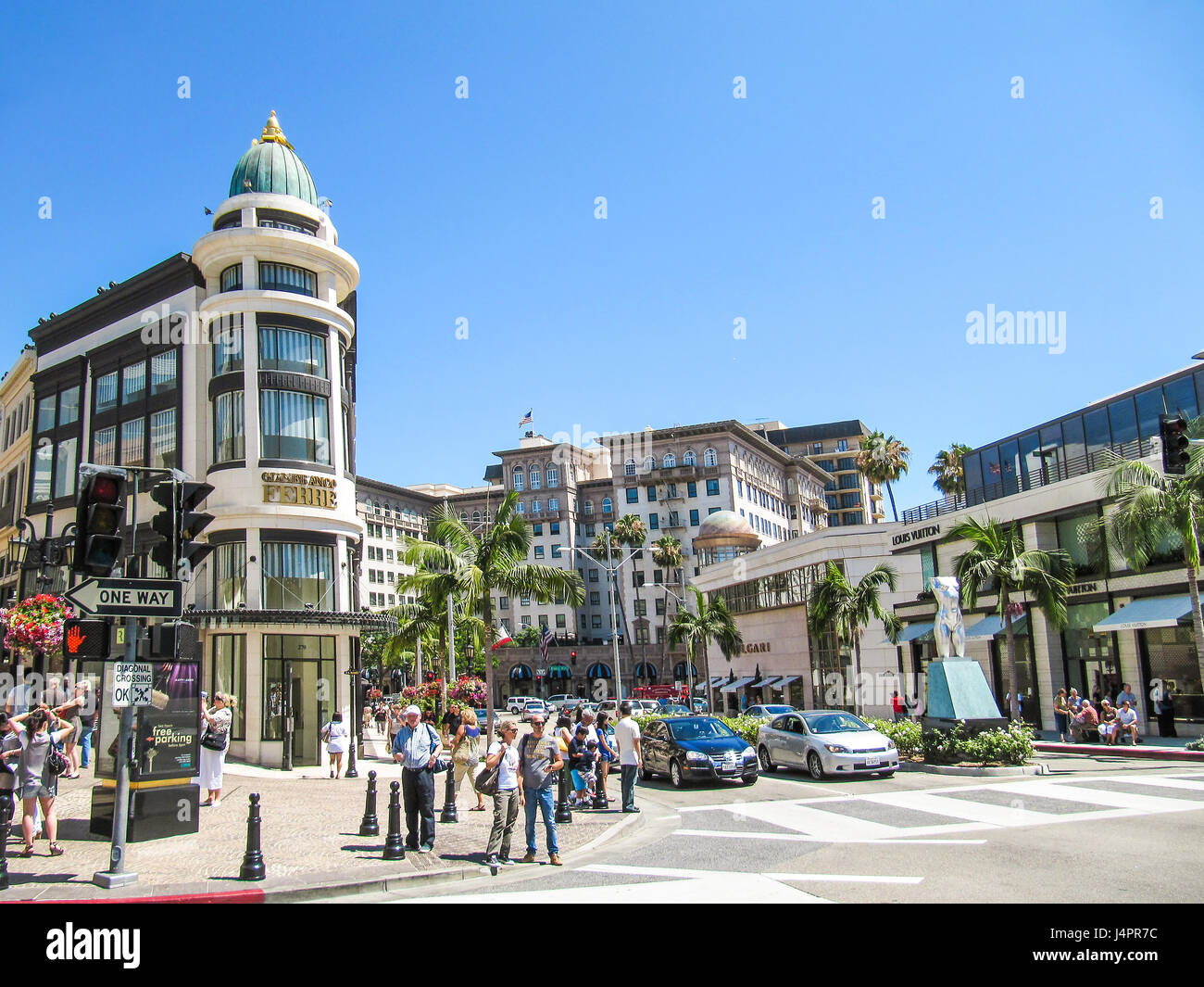 Los Angeles, USA - May 25, 2010: Rodeo drive with people, stores and road with cars Stock Photo