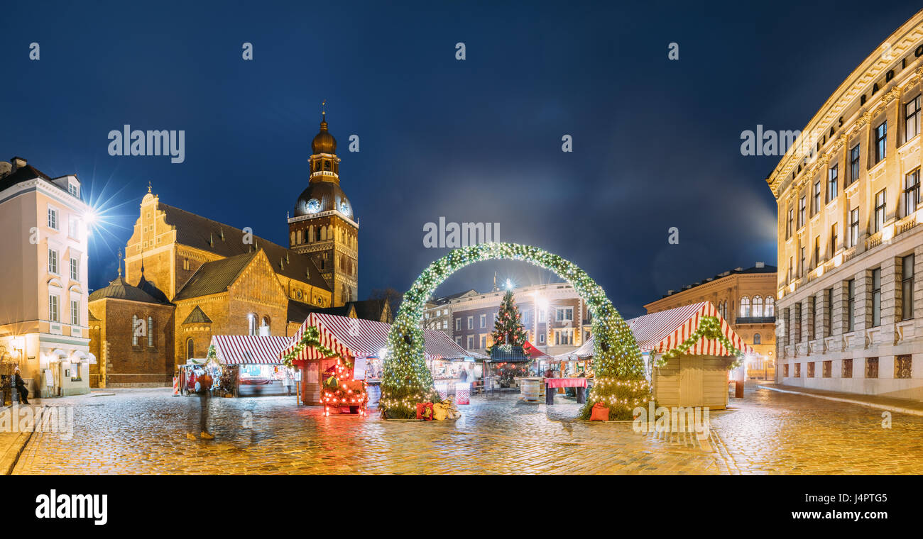 Riga, Latvia - December 13, 2016: Panorama Of Xmas Market On Dome Square With Riga Dome Cathedral. Christmas Tree And Trading Houses. Famous Landmark  Stock Photo