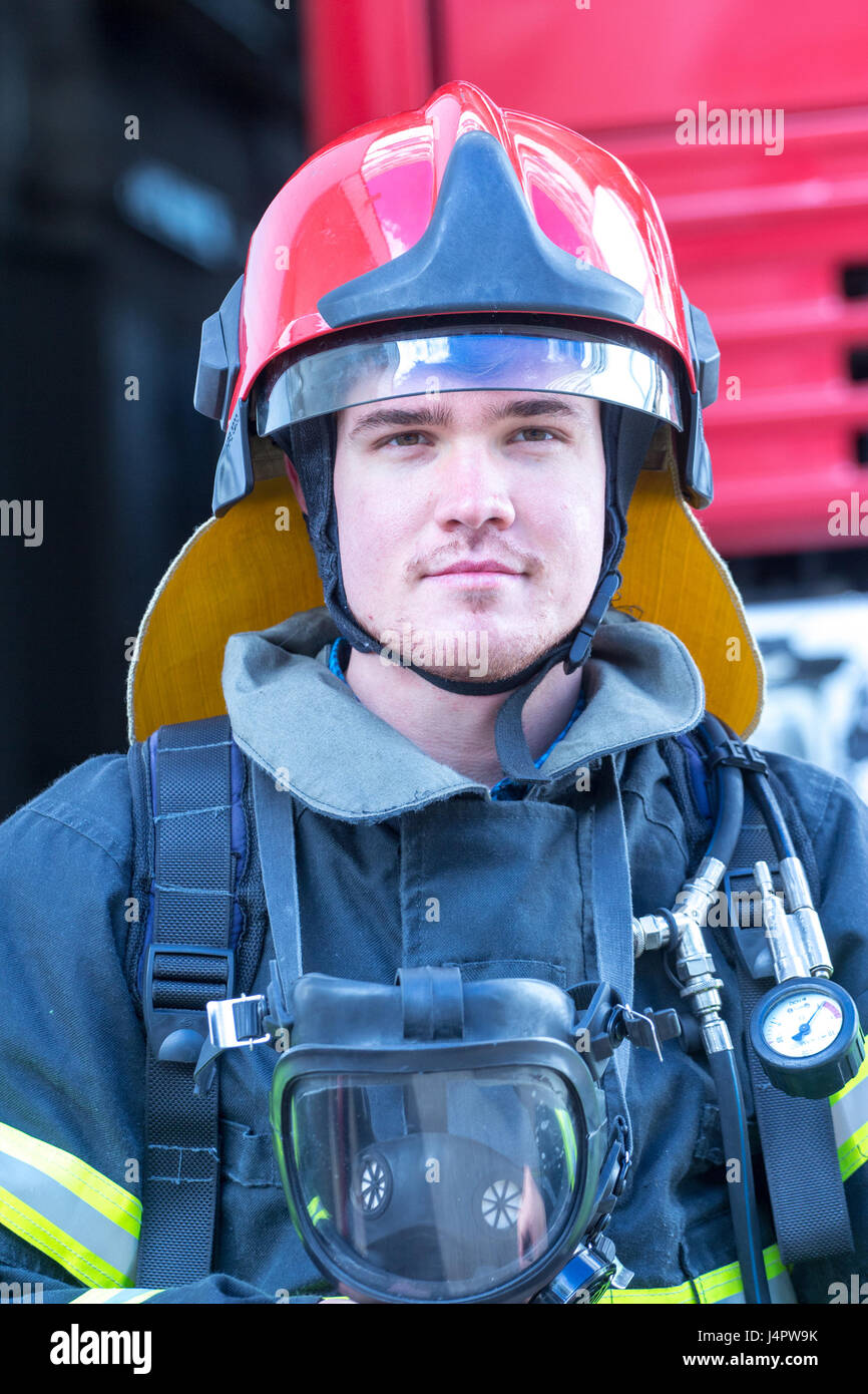 portrait-of-a-fireman-with-car-on-background-stock-photo-alamy