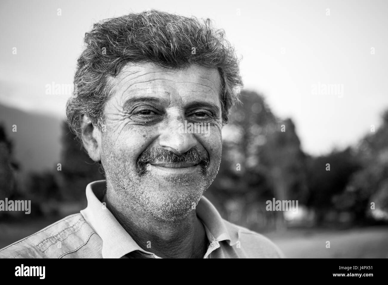 Close up portrait of mature armenian peasant on natural background Stock Photo