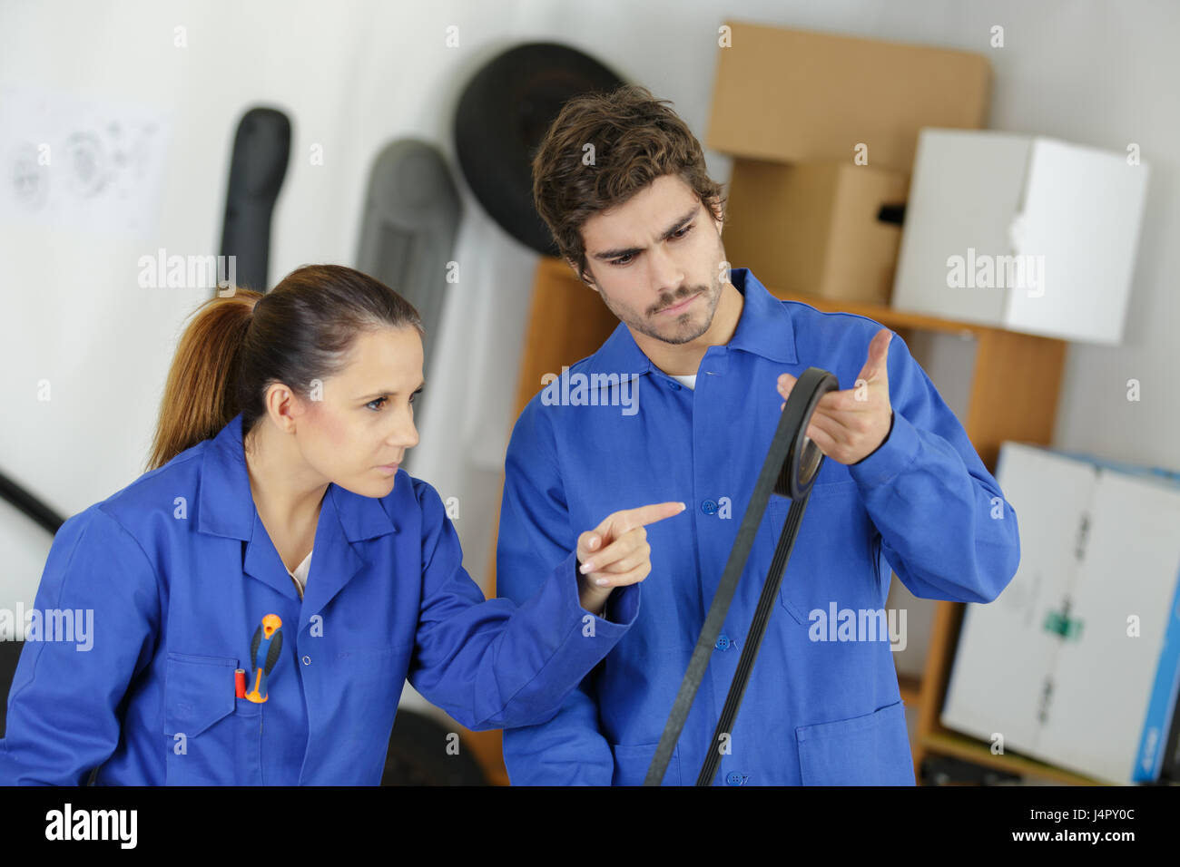 Engineers looking at rubber gasket Stock Photo