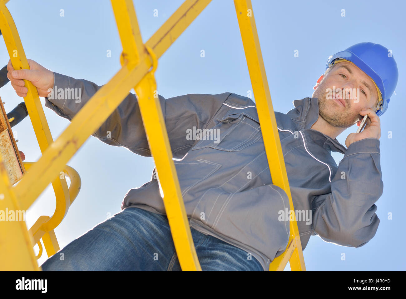 calling while on a platform Stock Photo