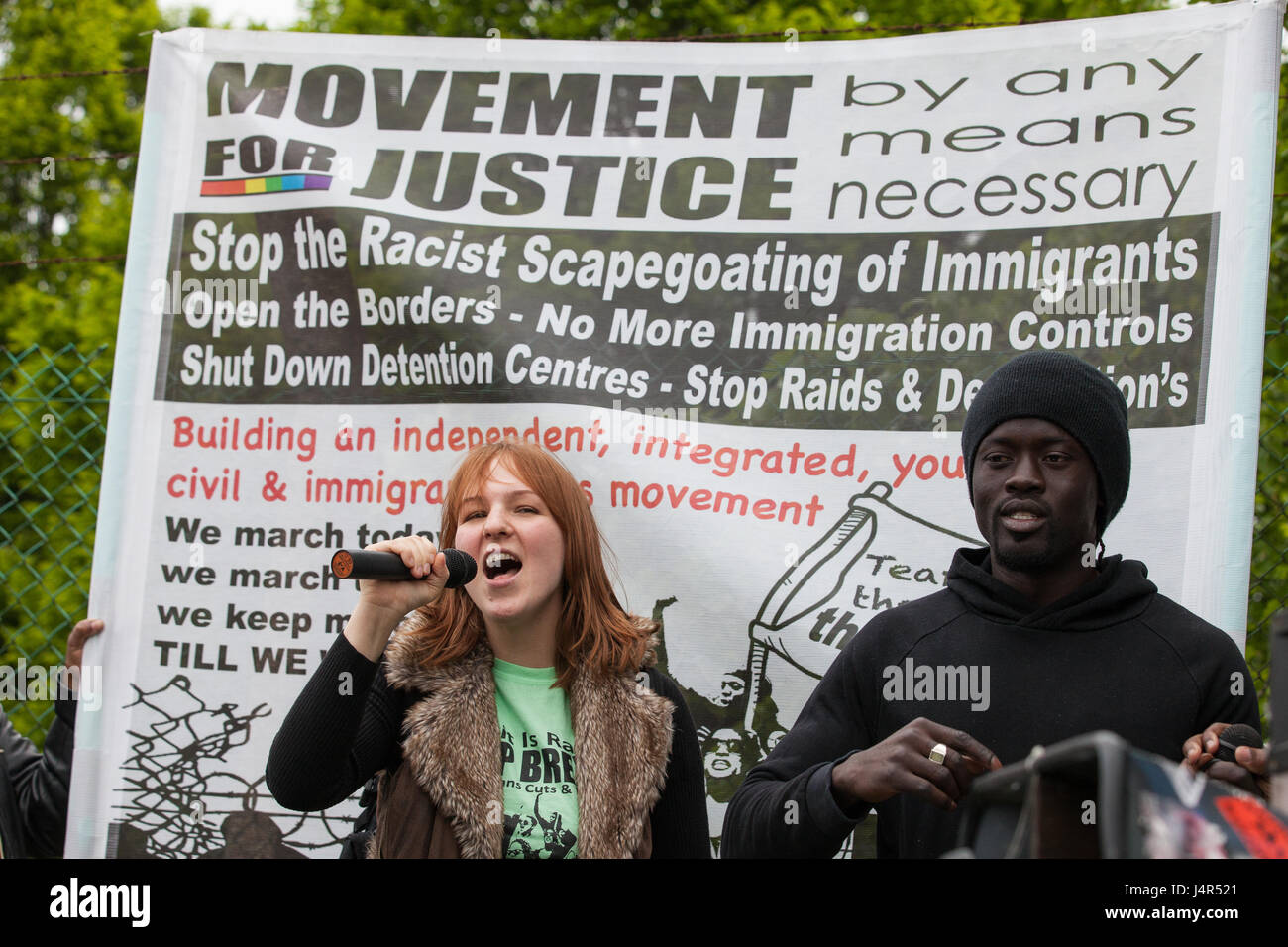 Milton Ernest, UK. 13th May, 2017. Activists from Movement For Justice By Any Means Necessary address a large protest outside Yarl's Wood Immigration Removal Centre to call for all immigration detention centres to be closed. Credit: Mark Kerrison/Alamy Live News Stock Photo