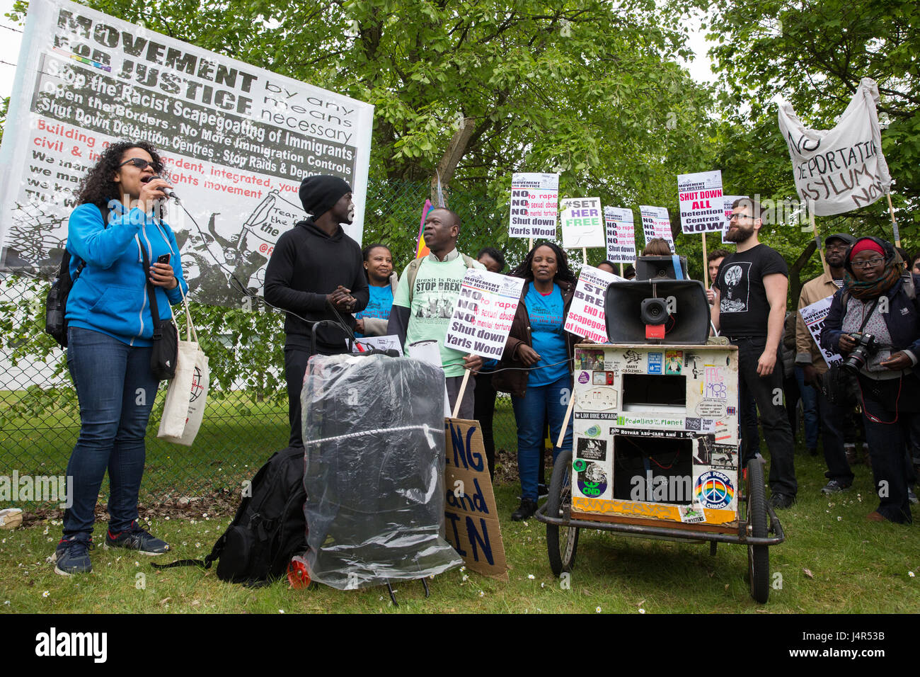 Milton Ernest, UK. 13th May, 2017. Antonia Bright from Movement For Justice By Any Means Necessary addresses a large protest outside Yarl's Wood Immigration Removal Centre calling for all immigration detention centres to be closed. Credit: Mark Kerrison/Alamy Live News Stock Photo