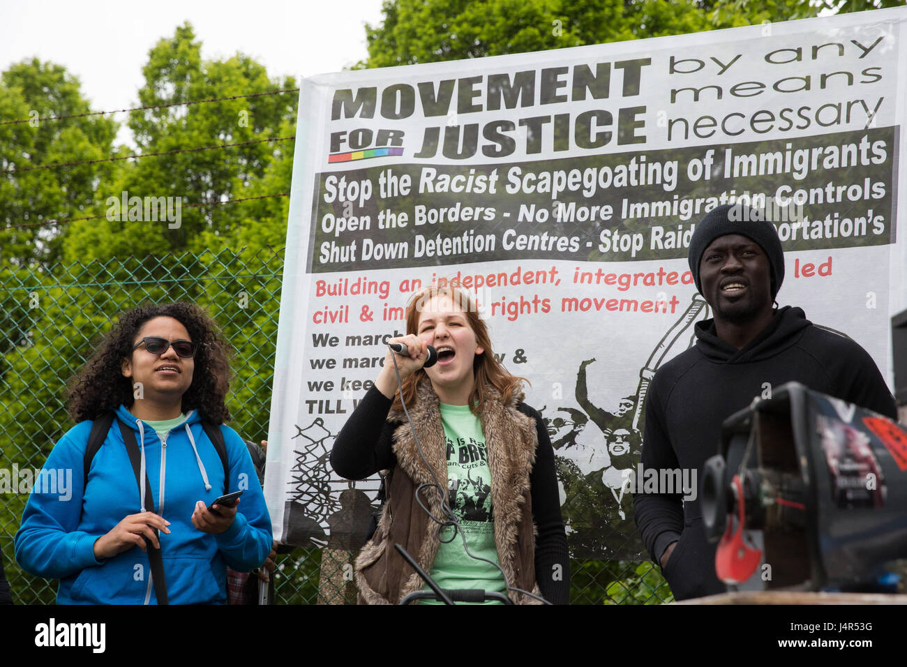 Milton Ernest, UK. 13th May, 2017. Activists from Movement For Justice By Any Means Necessary address a large protest outside Yarl's Wood Immigration Removal Centre to call for all immigration detention centres to be closed. Credit: Mark Kerrison/Alamy Live News Stock Photo