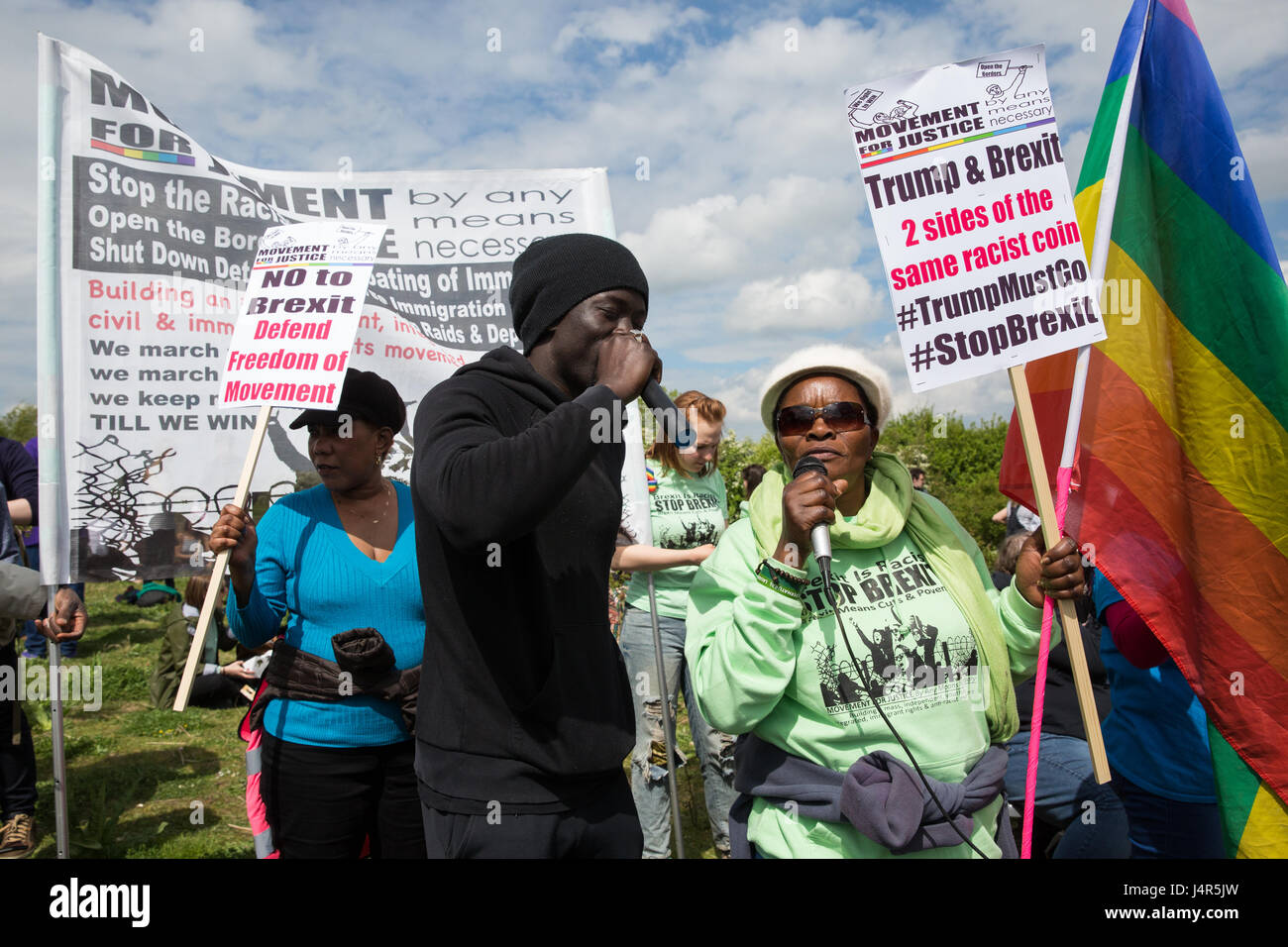 Milton Ernest, UK. 13th May, 2017. Activists from Movement For Justice By Any Means Necessary address a large protest outside Yarl's Wood Immigration Removal Centre to call for all immigration detention centres to be closed. Stock Photo