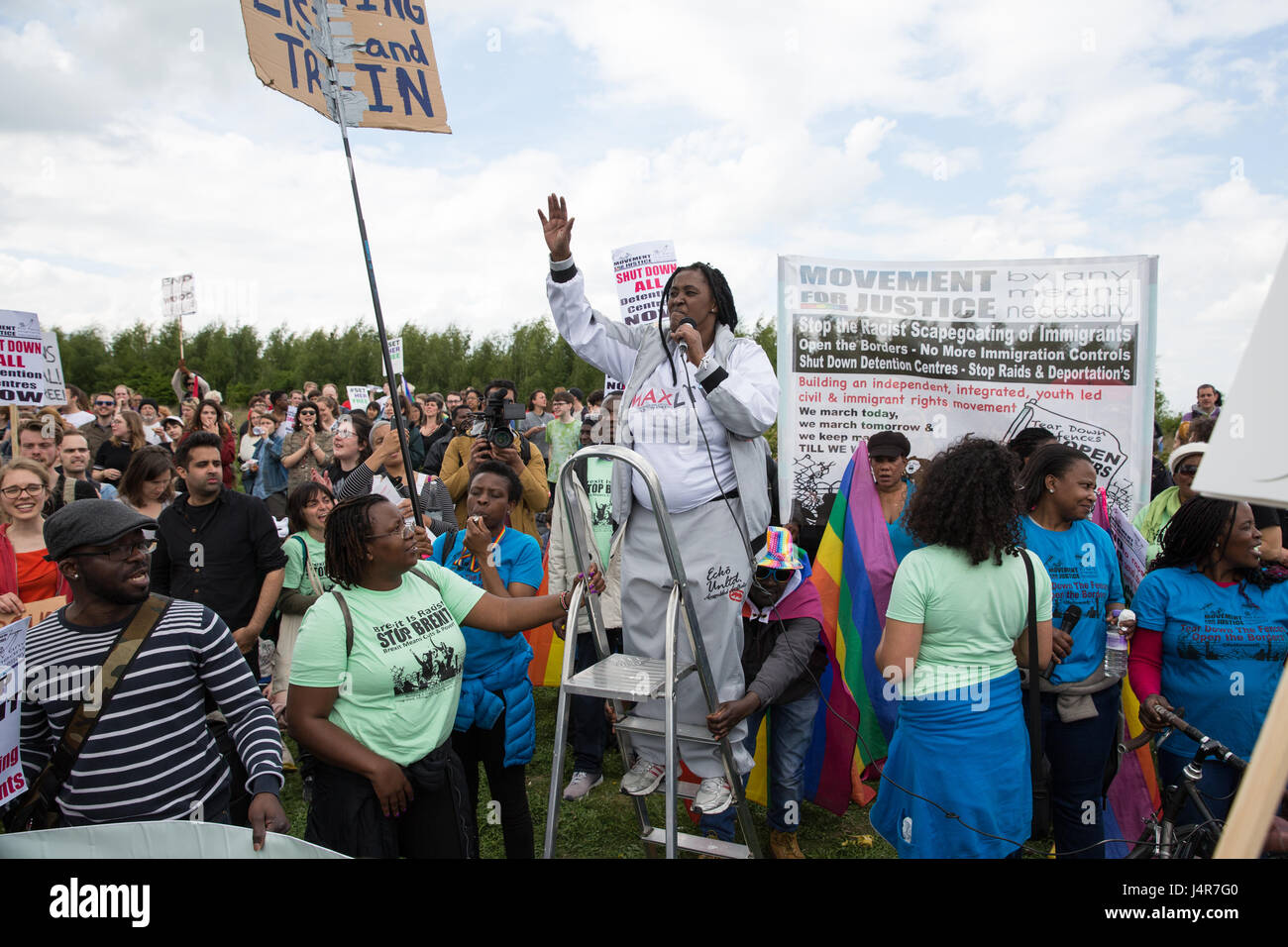 Milton Ernest, UK. 13th May, 2017. Mabel Gawanas, who was detained for almost three years at Yarl's Wood Immigration Removal Centre, addresses over a thousand campaigners against immigration detention attending a protest organised by Movement For Justice By Any Means Necessary outside the detention centre. Campaigners, including former detainees, called for all immigration detention centres to be closed. Credit: Mark Kerrison/Alamy Live News Stock Photo