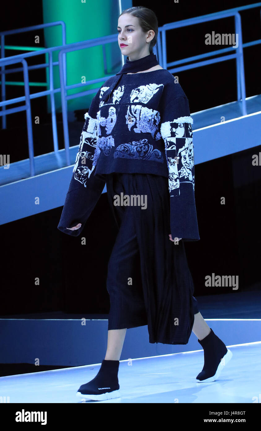 Beijing, China. 13th May, 2017. A model presents a creation at China Graduate Fashion Week in Beijing, capital of China, May 13, 2017. Credit: Li Mingfang/Xinhua/Alamy Live News Stock Photo