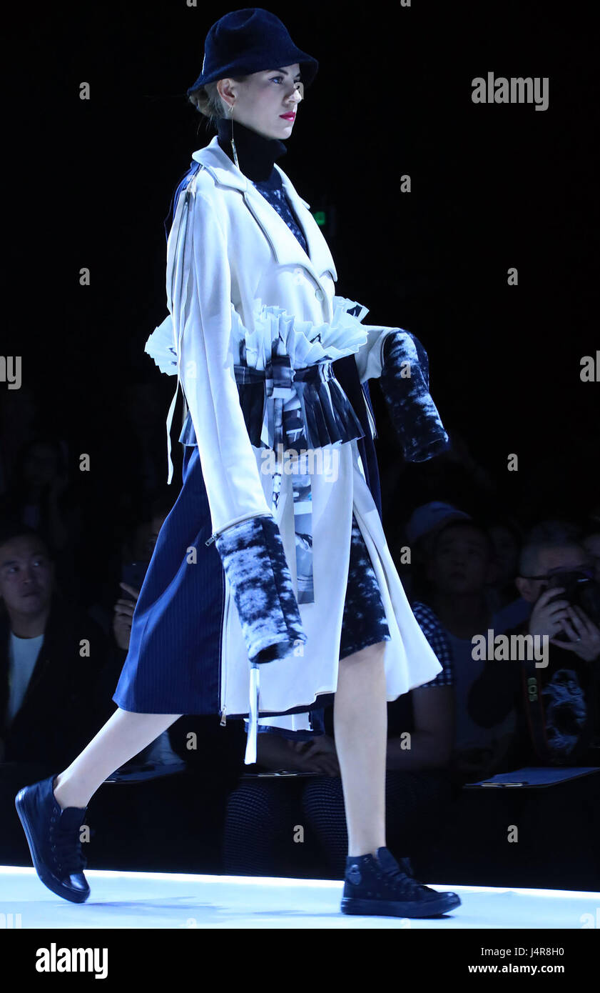 Beijing, China. 13th May, 2017. A model presents a creation at China Graduate Fashion Week in Beijing, capital of China, May 13, 2017. Credit: Li Mingfang/Xinhua/Alamy Live News Stock Photo