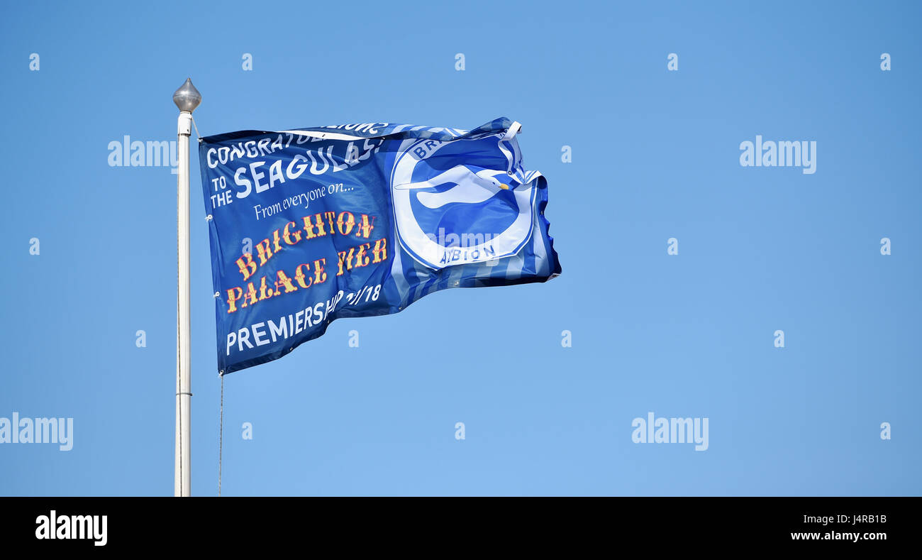 Brighton, UK. 14th May, 2017. Brighton Palace Pier with Congratulations flags for Brighton and Hove Albion's promotion to the Premier League on a beautiful sunny day with temperatures expected to reach over 20 degrees celsius later in the day . Credit: Simon Dack/Alamy Live News Stock Photo