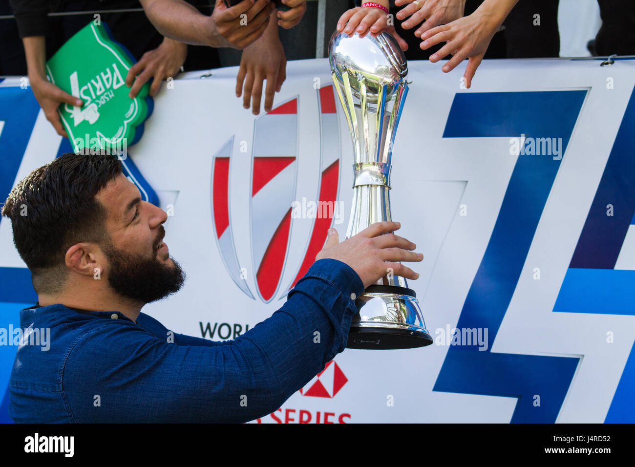 Paris, France. 14th May 2017. Rabah Slimani letting fans touch the Challenge Cup as the Stade Francais Paris players parade the trophy around their home ground, Stade Jean Bouin. They beat Gloucester 25 - 17 in Murrayfield, Scotland to clinch the trophy. Credit: Elsie Kibue / Alamy Live News Stock Photo