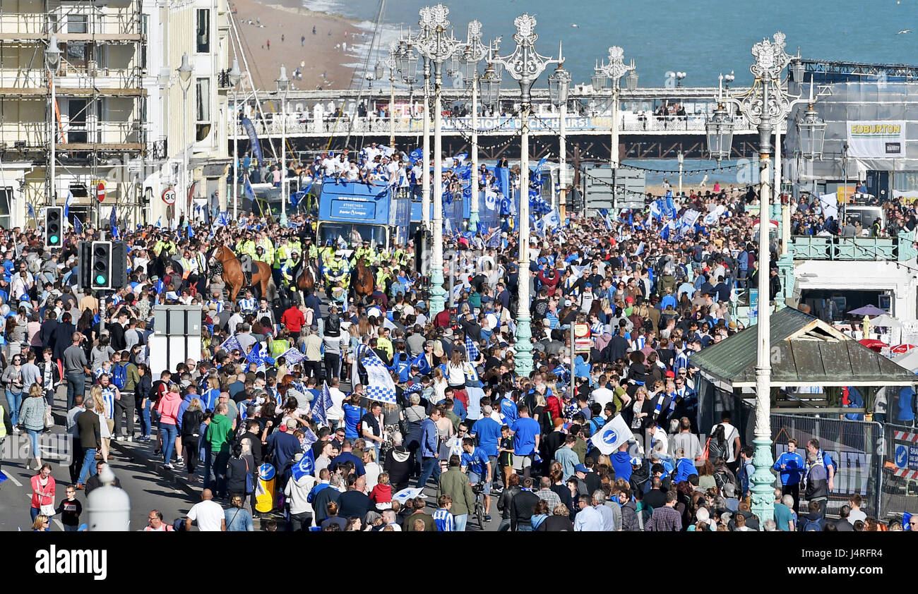 Brighton, UK. 14th May, 2017. Thousands of fans line Brighton seafront to watch the Brighton and Hove Albion football club bus parade to celebrate their promotion to the Premier League in beautiful sunny weather Credit: Simon Dack/Alamy Live News Stock Photo