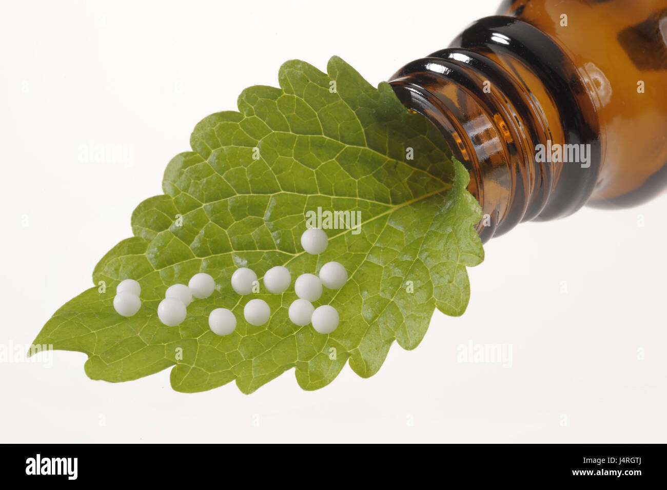 Alternative medicine, homoeopathy, Globuli, leaves, medicament bottle, studio, medium close-up, Stock Photo