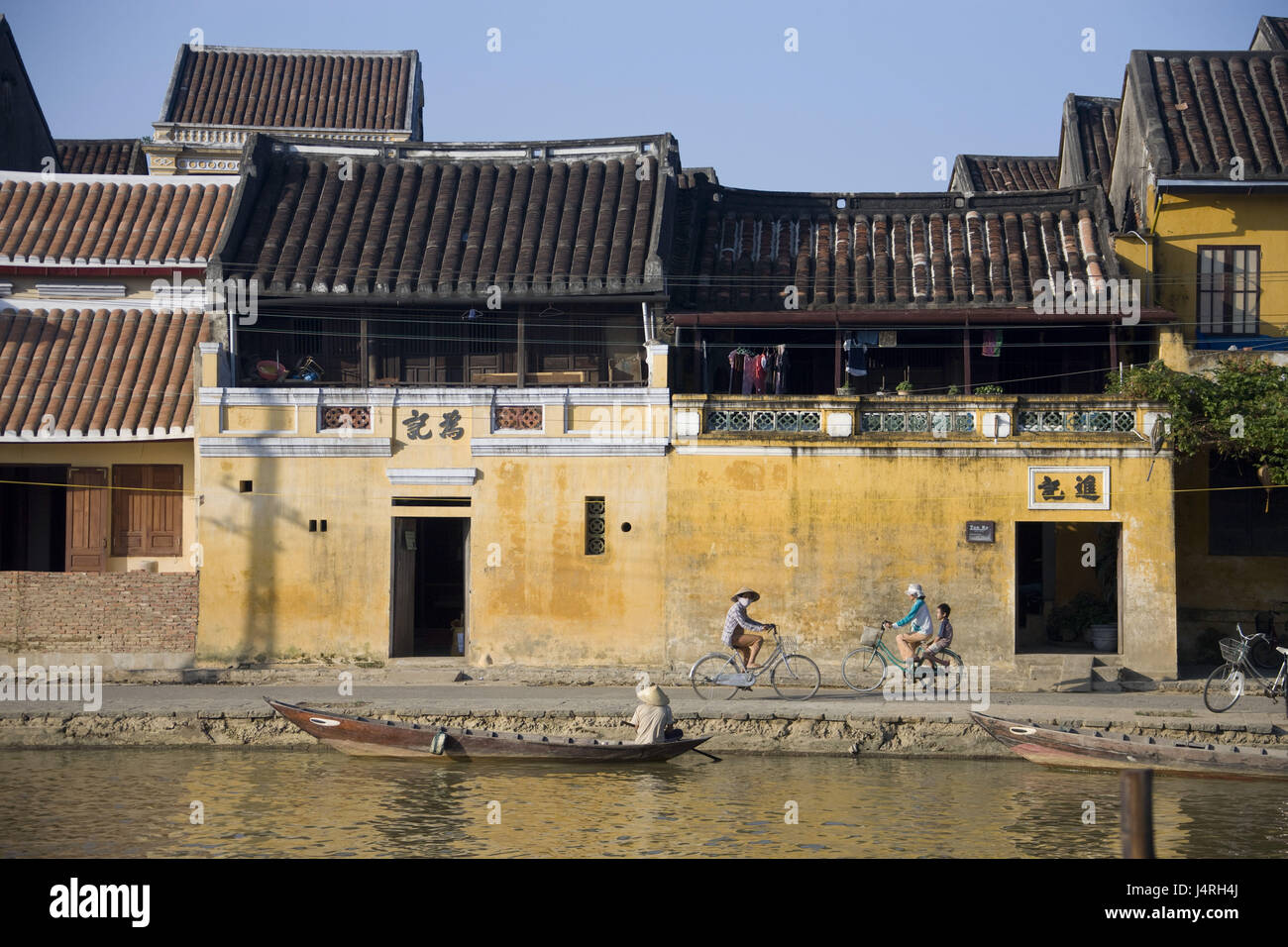 Vietnam, Hoi In, Tan Ky house, boat, fisherman, cyclist, Stock Photo