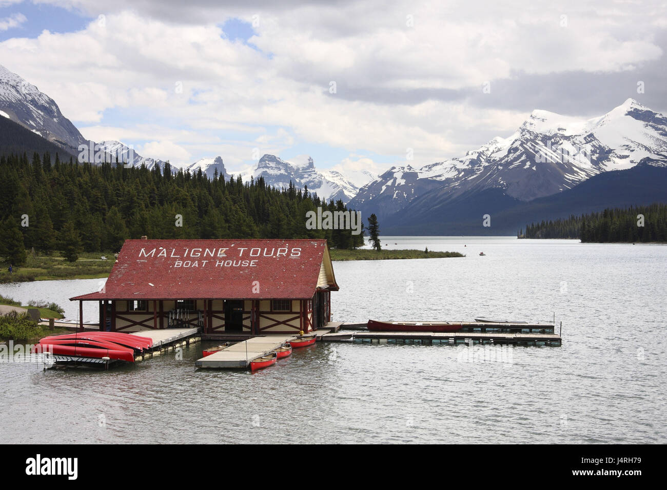 Mountain lake, boathouse, canoes, shores, wooded, horizon, mountain ...