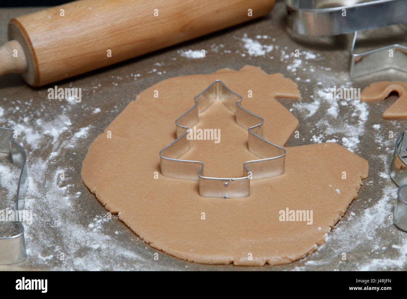 Cutter on gingerbread dough Stock Photo