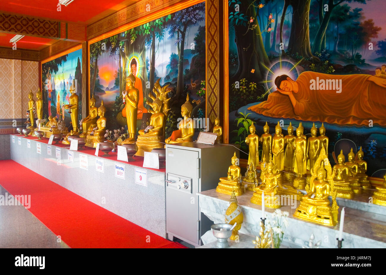 Phuket, Thailand, January 27, 2017: Golden Buddha sculpture standing in a row in the temple. Stock Photo