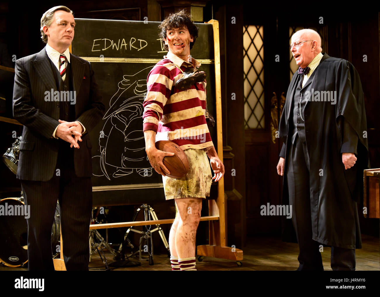Michael Hamway playing Tredgold (centre, holding rugby ball), Alan Cox as Franklin, the new headmaster (left) & Richard Wilson (right) as Headmaster Stock Photo