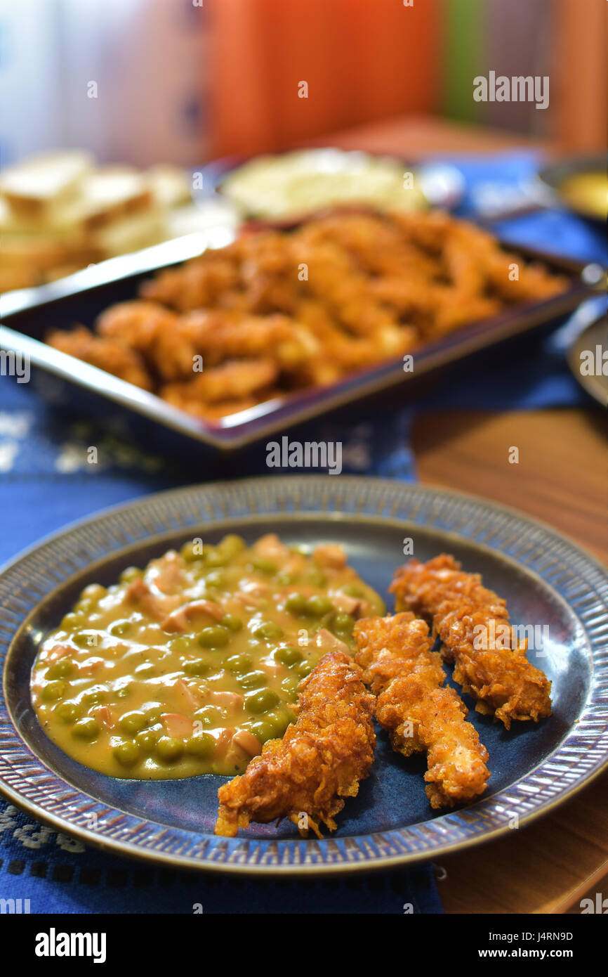 Traditional romanian peas with chicken crisps Stock Photo