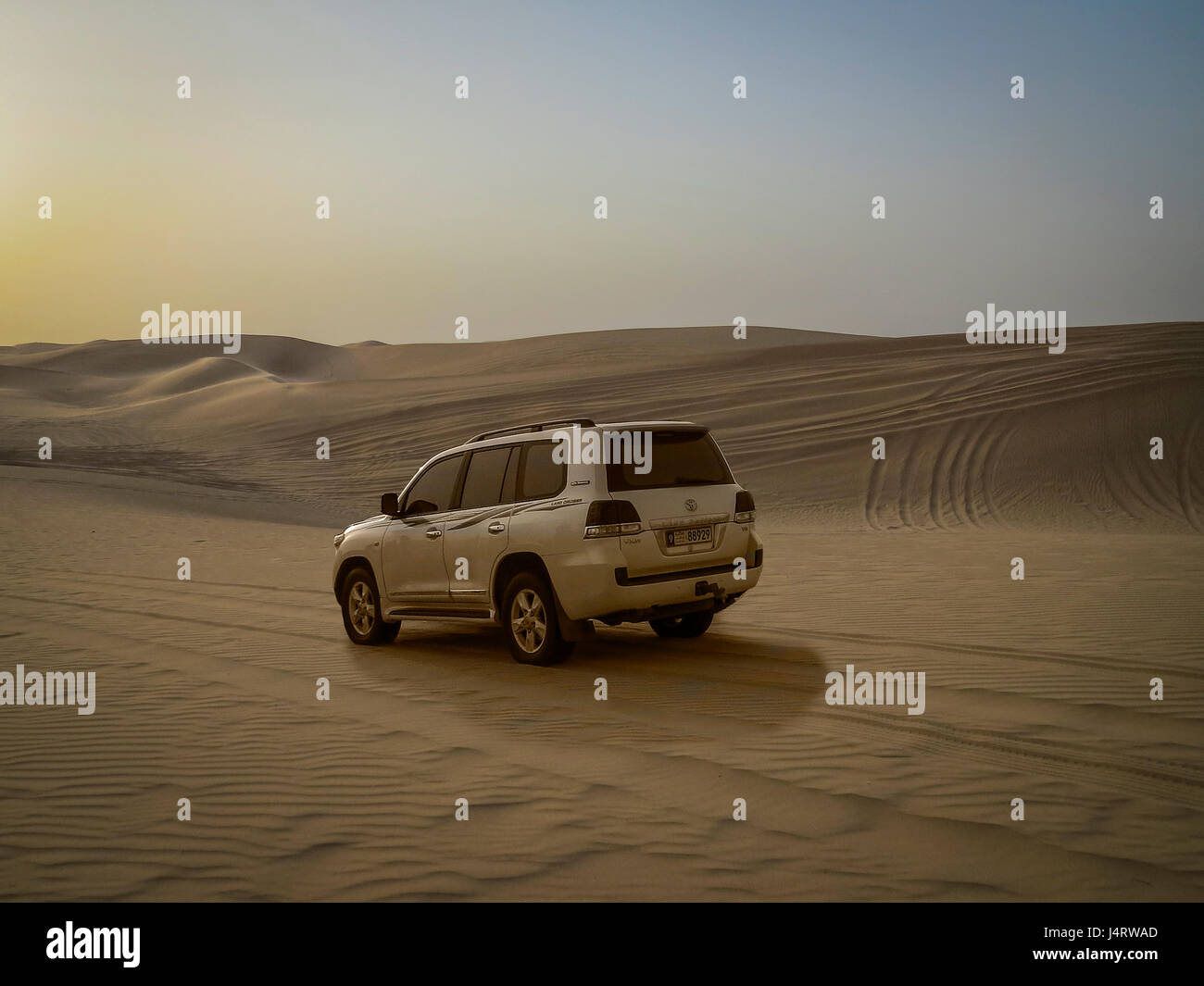 ARABIAN DESERT, ABU DHABI,UAE,8TH SEPT 2015:-Dune bashing at Dusk in 4 wheel drive trucks Stock Photo